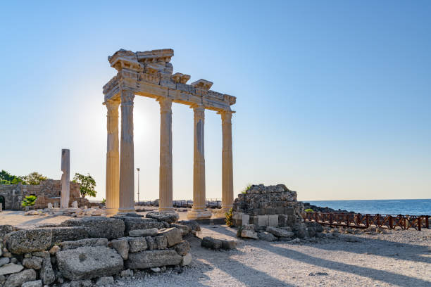 Awesome ruins of the Temple of Apollo in Side, Turkey Awesome ruins of the Temple of Apollo on the Mediterranean Sea coast in Side, Turkey. The Roman temple is a popular tourist attraction in Turkey. Amazing view of columns on sunny day. temple of apollo antalya province stock pictures, royalty-free photos & images