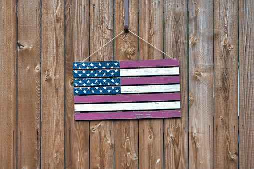 The Stars and Stripes: Faded Wooden American Flag