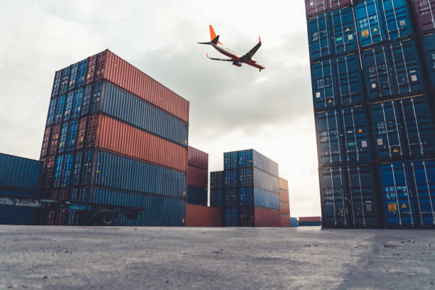 istock Freight airplane flying above overseas shipping container . Logistics supply chain management and international goods export concept . 1466225852