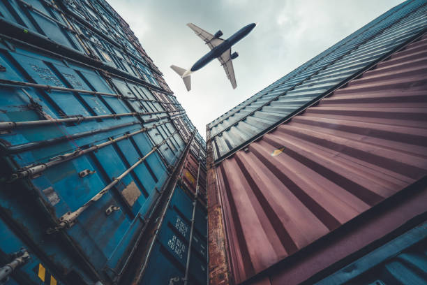 istock Freight airplane flying above overseas shipping container . Logistics supply chain management and international goods export concept . 1466226270