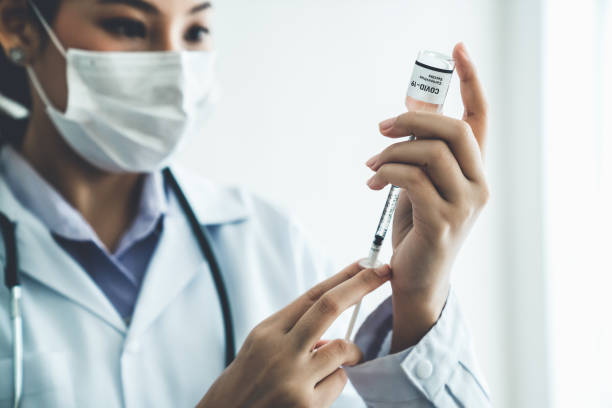 istock Skillful doctor prepare vaccine proficiently before injection . Covid 19 and coronavirus vaccination center service concept . 1466227733