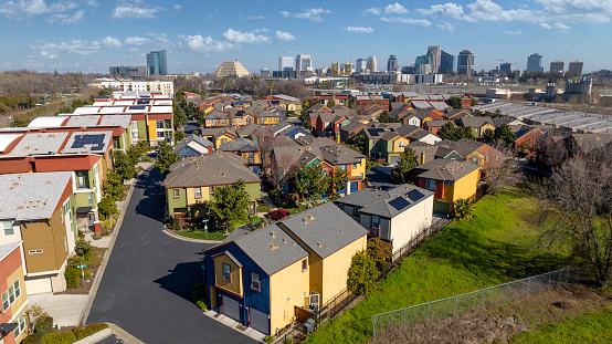 High quality aerial photos of downtown Sacramento with residential apartment duplexes in the foreground.