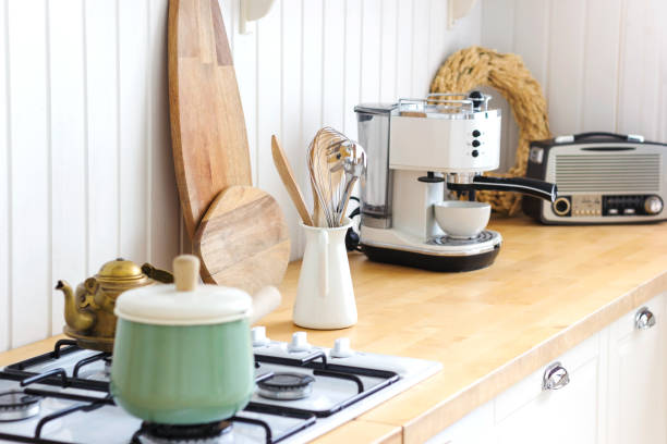 istock Kitchen wooden table and kitchen background. Interior style is cosy and scandinavian. High quality interior scandi photo. 1466236408