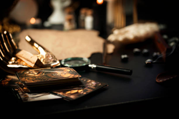 istock Defocused still Life with tarot cards. magic or fortune telling rite with occult and esoteric symbols. 1466246674