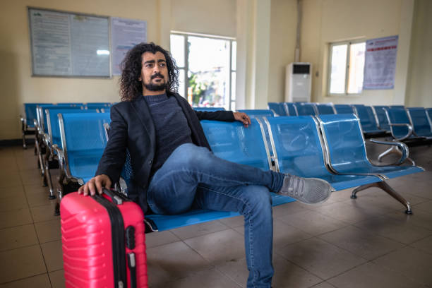 istock Young man at the train station 1466249509