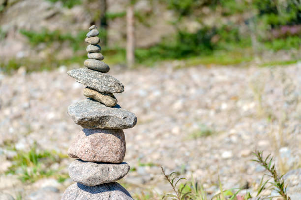 istock Pyramid of stones. Unstable balance of stone objects. 1466252904