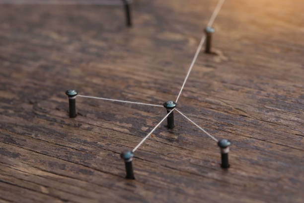 istock Network connected with yarn white on plank wood 1466270445