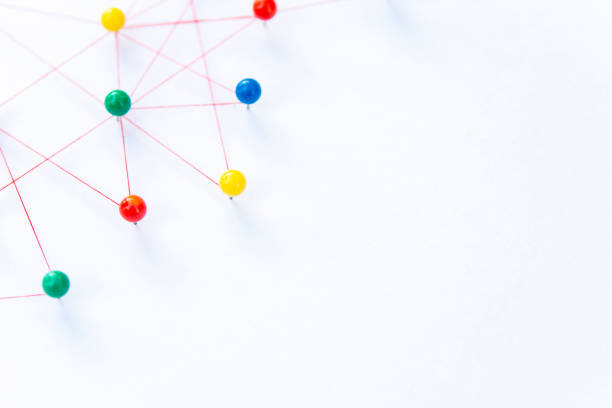 istock Linking entities, Blockchain, social media, Communications Network, The connection between the two networks. Network simulation on paper linked together by yarn 1466270747