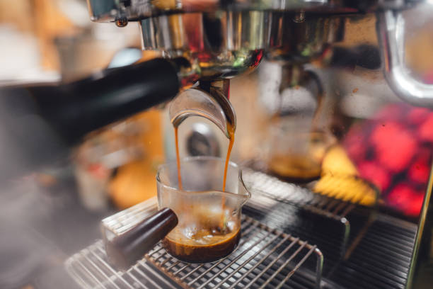 istock Hot coffee from the machine into the coffee cup 1466272008
