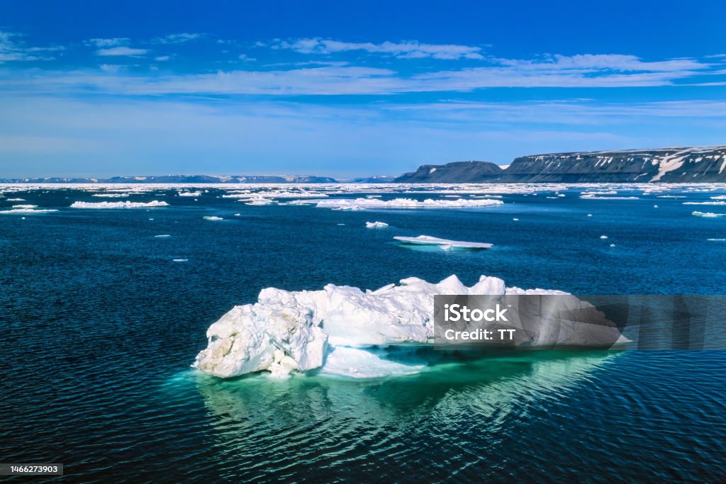 Ice floes at the rocky coastline of Svalbard Northern Hemisphere Stock Photo