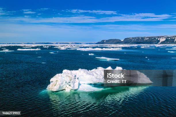 Ice Floes At The Rocky Coastline Of Svalbard Stock Photo - Download Image Now - Northern Hemisphere, Remote Location, Archipelago