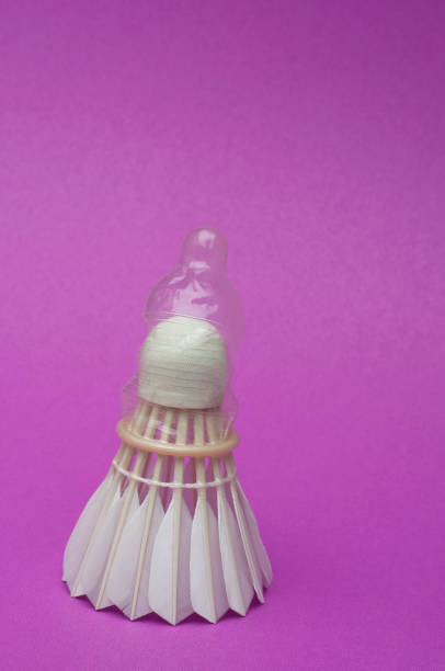 A close-up of a condom on a badminton ball. stock photo