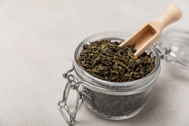 istock Different types of tea on a light texture background.Tea mix.Assortment.Black,green, herbal and hibiscus tea.Side view.Copy space. 1466276657