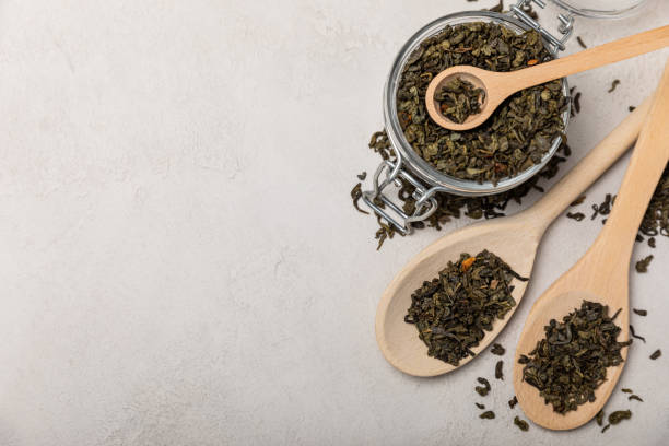 istock Different types of tea on a light texture background.Tea mix.Assortment.Black,green, herbal and hibiscus tea.Side view.Copy space. 1466276814