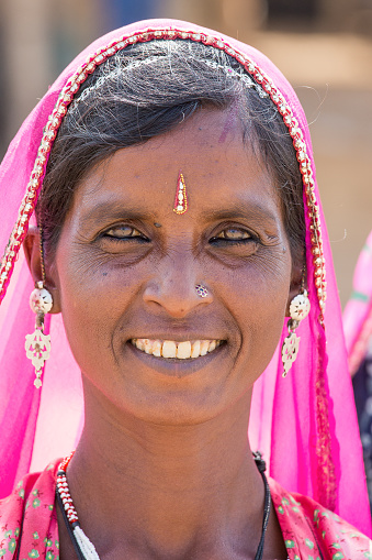 PUSHKAR, INDIA - OCTOBER 28, 2014: Unidentified woman at the attended the annual Pushkar Camel Mela. This fair is the largest camel trading fair in the world.