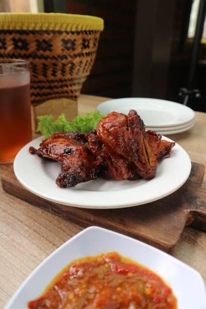 istock Indonesian style fried chicken with various spices served with chili sauce 1466286993