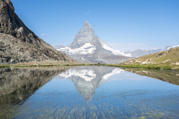 istock Matterhorn reflection in Riffelsee, Zermatt, Switzerland 1466288137