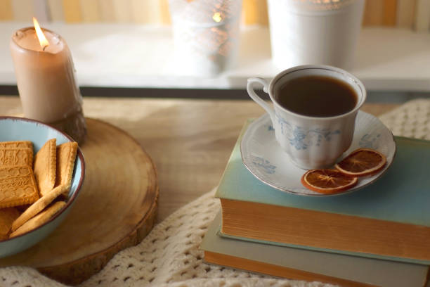 istock Books, Glasses, E-Reader, Cookies, Tea and Candle 1466289508