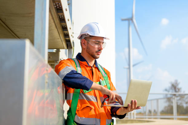 istock Renewable energy engineer working on wind turbine 1466290030