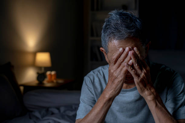istock Depressed senior Asian man sitting in bed cannot sleep from insomnia 1466291545