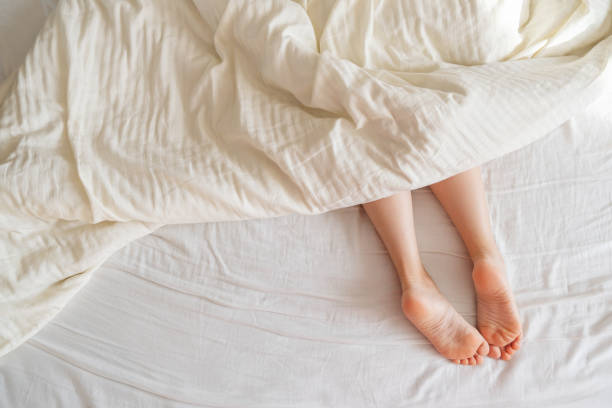 istock When a woman sleeps, her legs stick out 1466292005