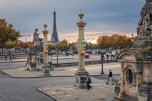 Eiffel Tower seen from the Place de la Concorde square in Paris on a fall day at sunset