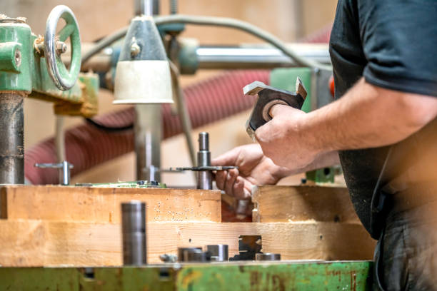 istock replacement of knives on a milling machine in a joinery 1466297147