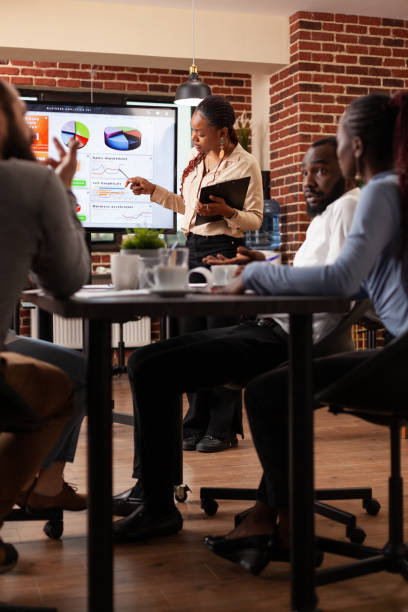 istock African american manager showing marketing presentation 1466300199