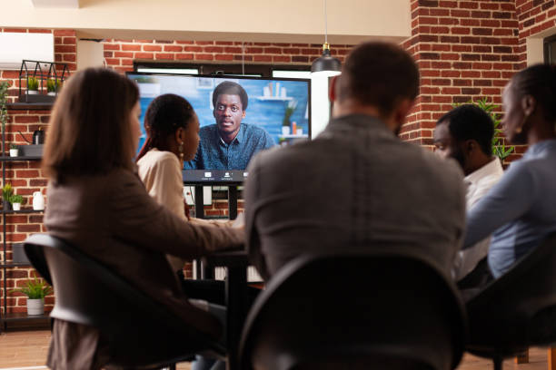 istock Diverse people discussing management partnership with remote manager 1466300674