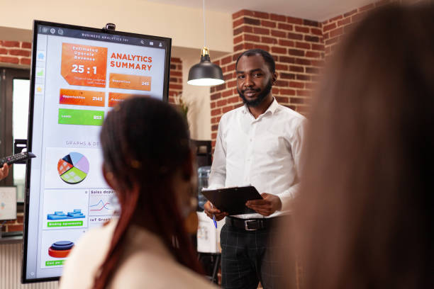 istock Businesspeople analyzing financial graph working at business presentation 1466302189