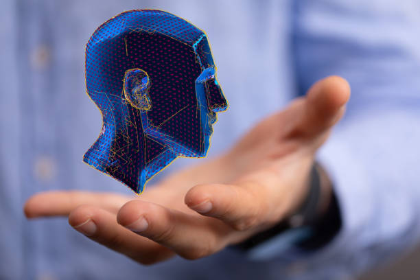 istock 3D blue abstract polygonal human head above a hand 1466302419