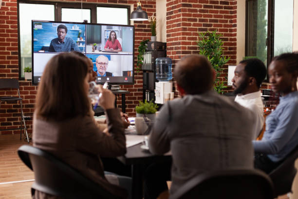 istock Diverse businessteam discussing management strategy with remote entrepreneurs 1466303033