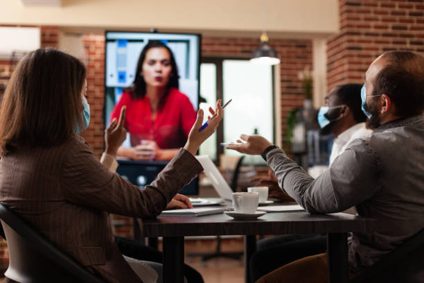 istock Entrepreneurs people explaining company strategy to remote collegue 1466303235