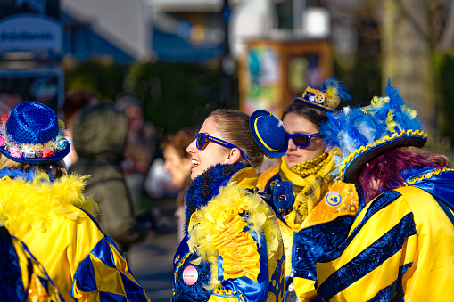 Children carnival of crèches with musicians in colorful costumes at City of Zürich district Schwamendingen on a sunny winter day. Photo taken February 10th, 2023, Zurich, Switzerland.