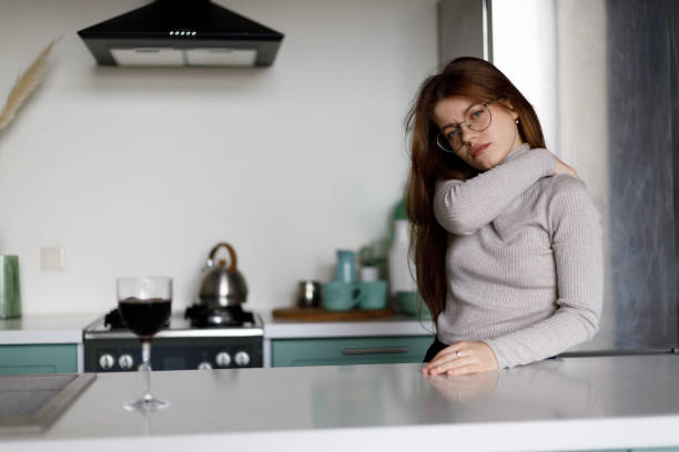 istock Back pain in a woman in a home interior. 1466305350