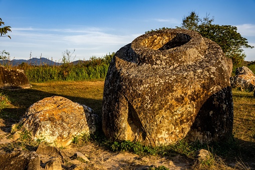The Plain of Jars, a megalithic archaeological landscape in Laos. Xieng Khouang at golden hour.