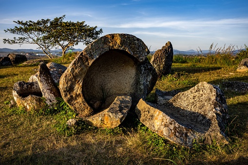 The Plain of Jars, a megalithic archaeological landscape in Laos. Xieng Khouang at golden hour.