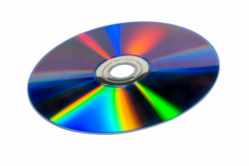 CD and DVD discs on dark background, top view