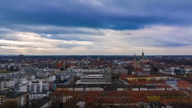 View over the city of Braunschweig in Lower Saxony with a dark cloudy sky.