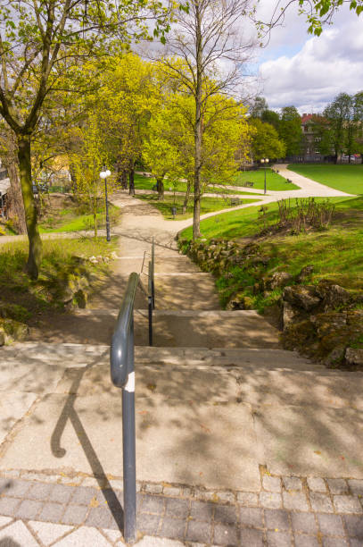 istock Stone steps with steel handrail in a park 1466311302