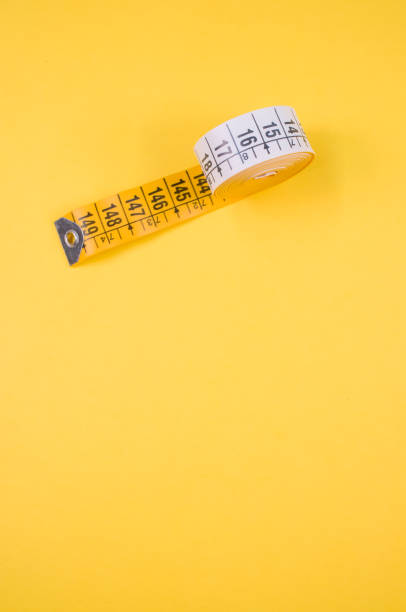 istock Close up of a meter roll isolated on a yellow background , with 1466313813