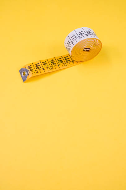 istock Close up of a meter roll isolated on a yellow background , with 1466313815
