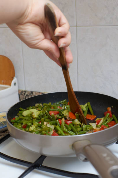 istock Meal with vegetables and other ingredients being cooked in a pan 1466317267