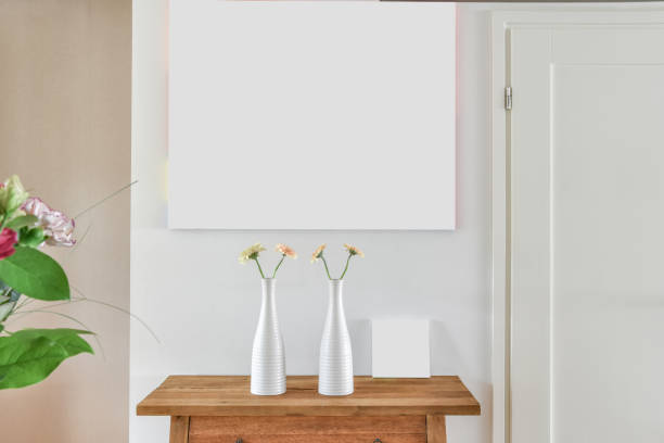 istock Two vase with flowers on the table in the room 1466318829