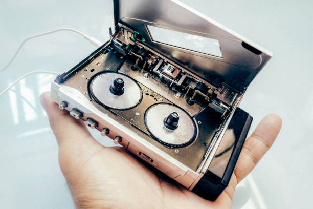 istock Person holding an old cassette tape in a studio 1466319061