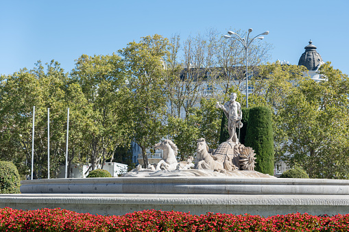 Fountain of Neptune in the Plaza de Neptuno in Madrid, Spain on a spring day