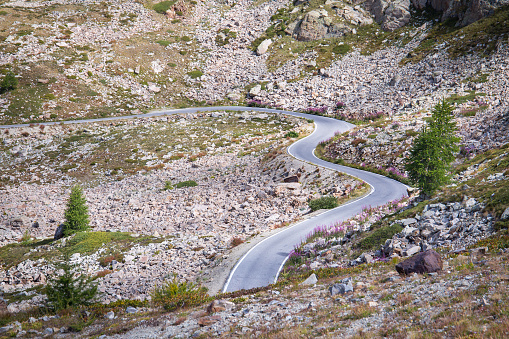 Curvy and winding mountain pass road Col de la Lombarde in the french and italian alps