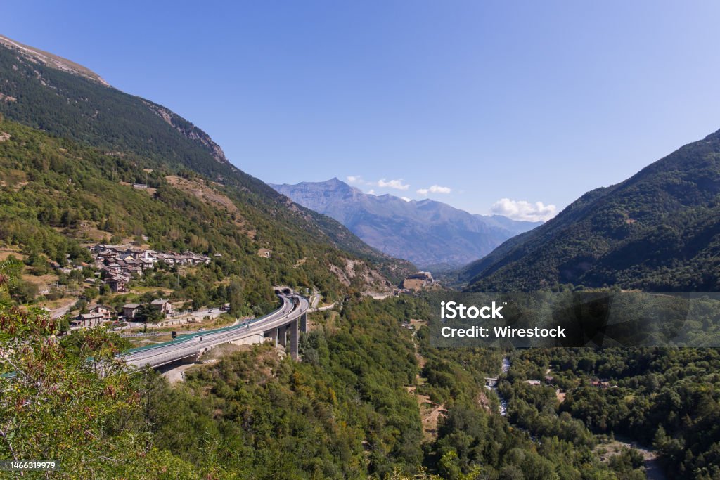 View into the Susa valley in the italian alps View into the Susa valley in the italian alps on a beautiful summer day Bridge - Built Structure Stock Photo