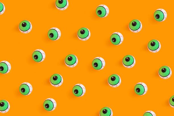 istock Round eye toys on an orange background 1466320664