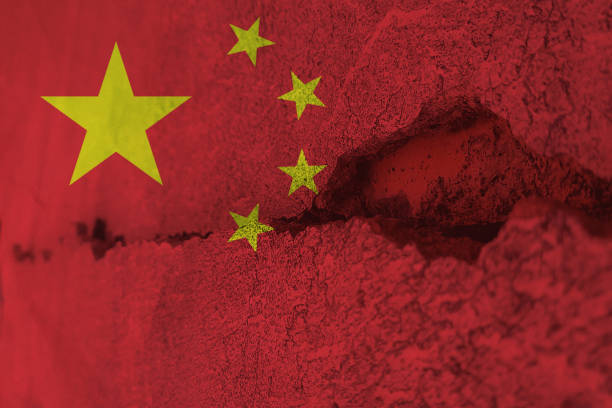 istock China flag on cracked wall. Earthquake or drought concept 1466322067